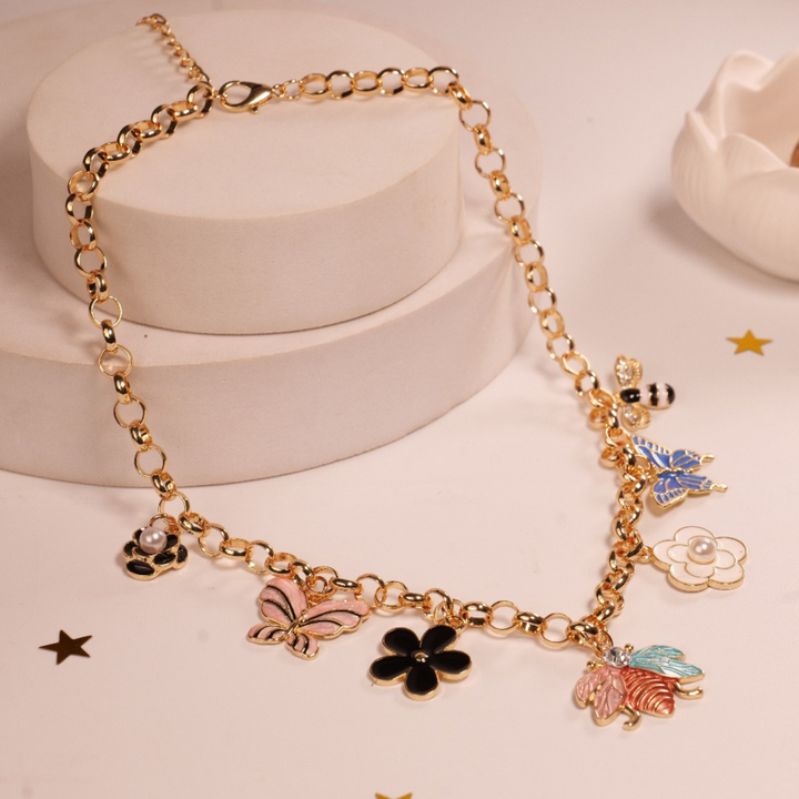 Garden Charms Necklace | Gold-Tone Chain with Enamel Butterfly, Flower, Bee & Ladybug Charms | Whimsical & Playful Statement Jewelry