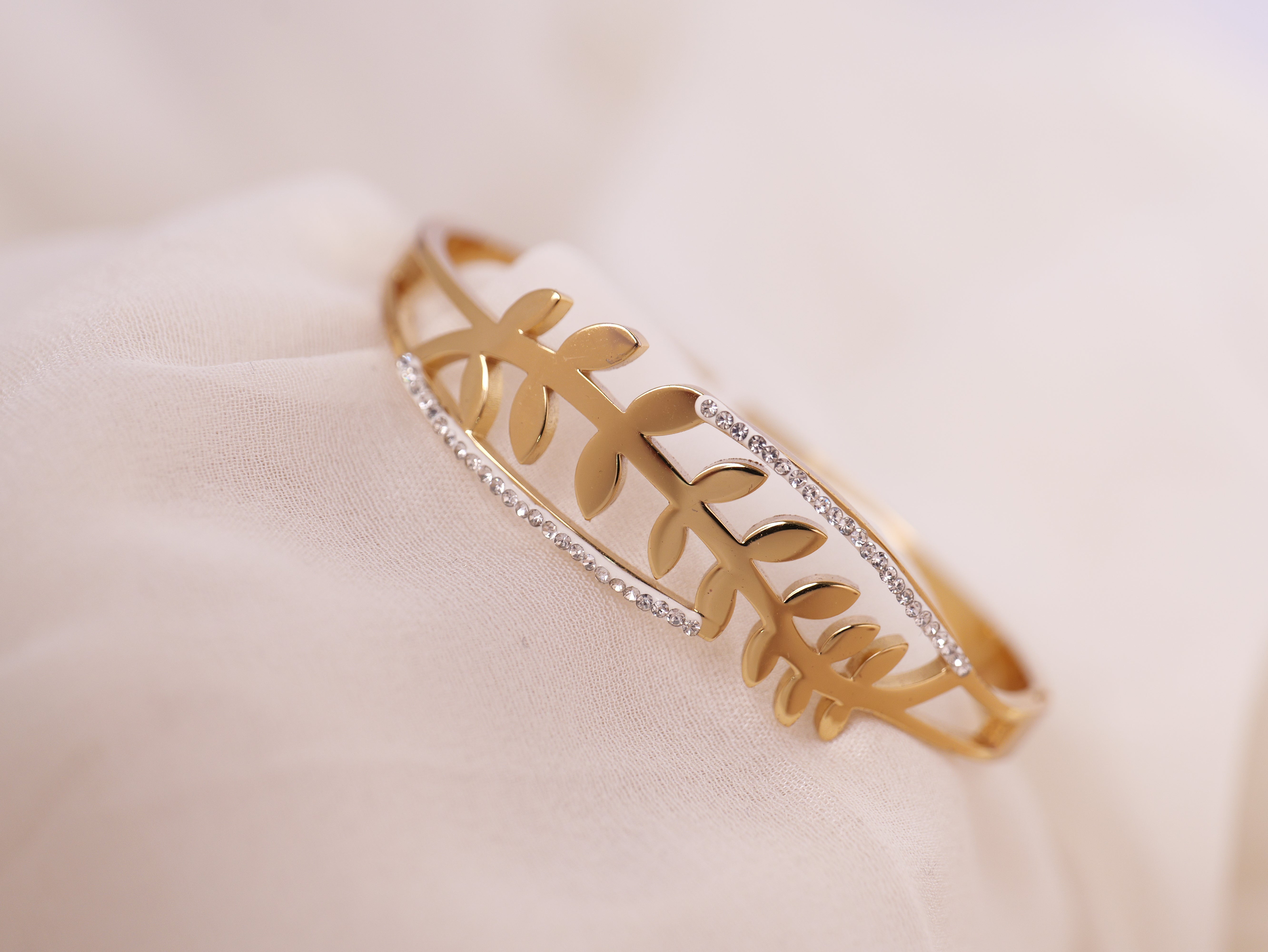 Leaf-Inspired Gold Bracelet with Crystal Accents
