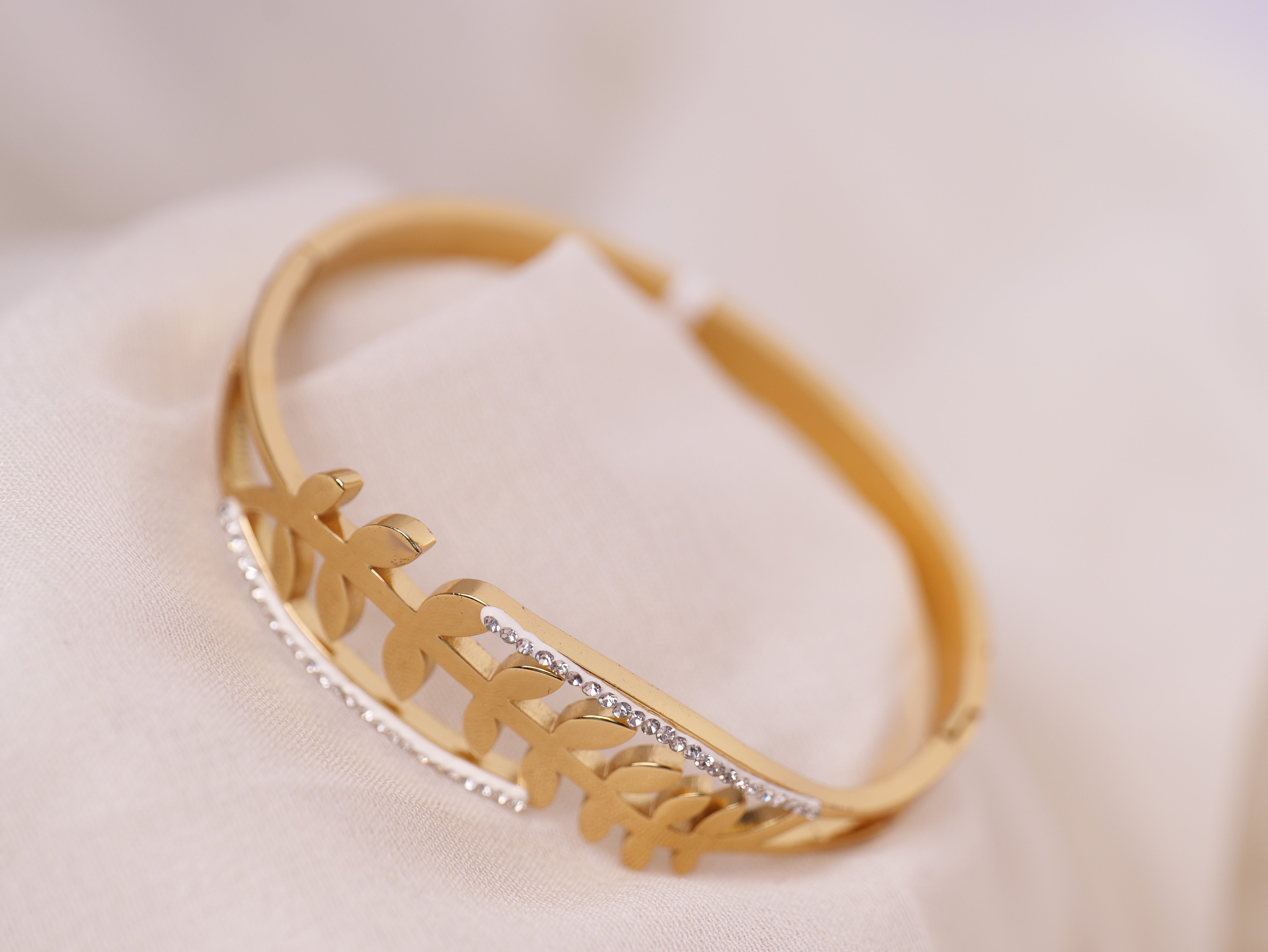 Leaf-Inspired Gold Bracelet with Crystal Accents
