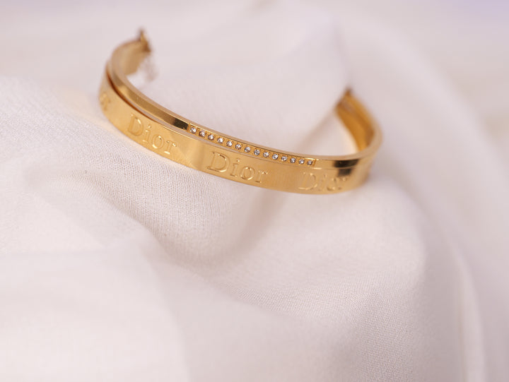 Elegant Gold “Dior” Engraved Bangle