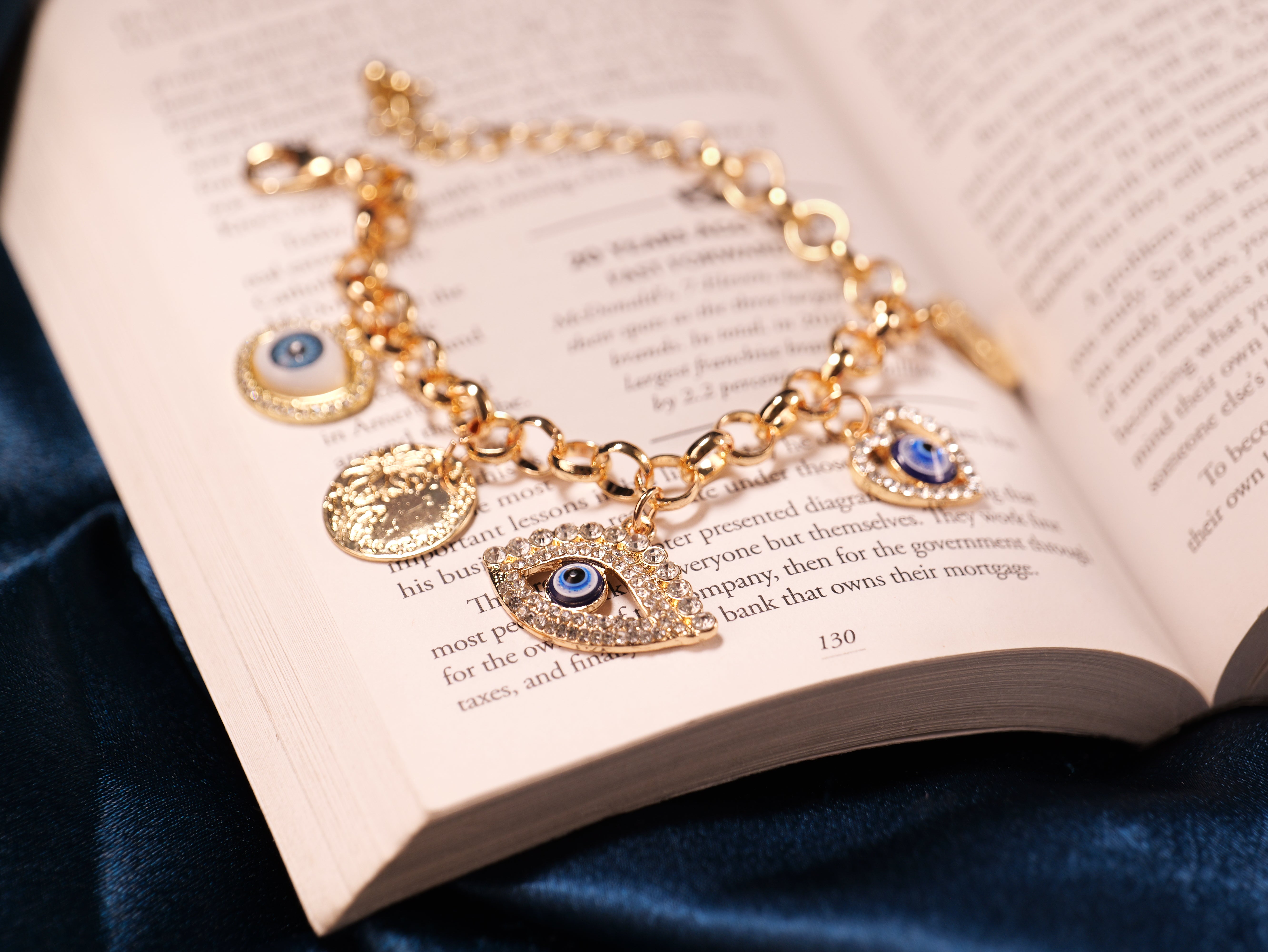 Elegant Gold-Tone Evil Eye Charm Bracelet with Crystals