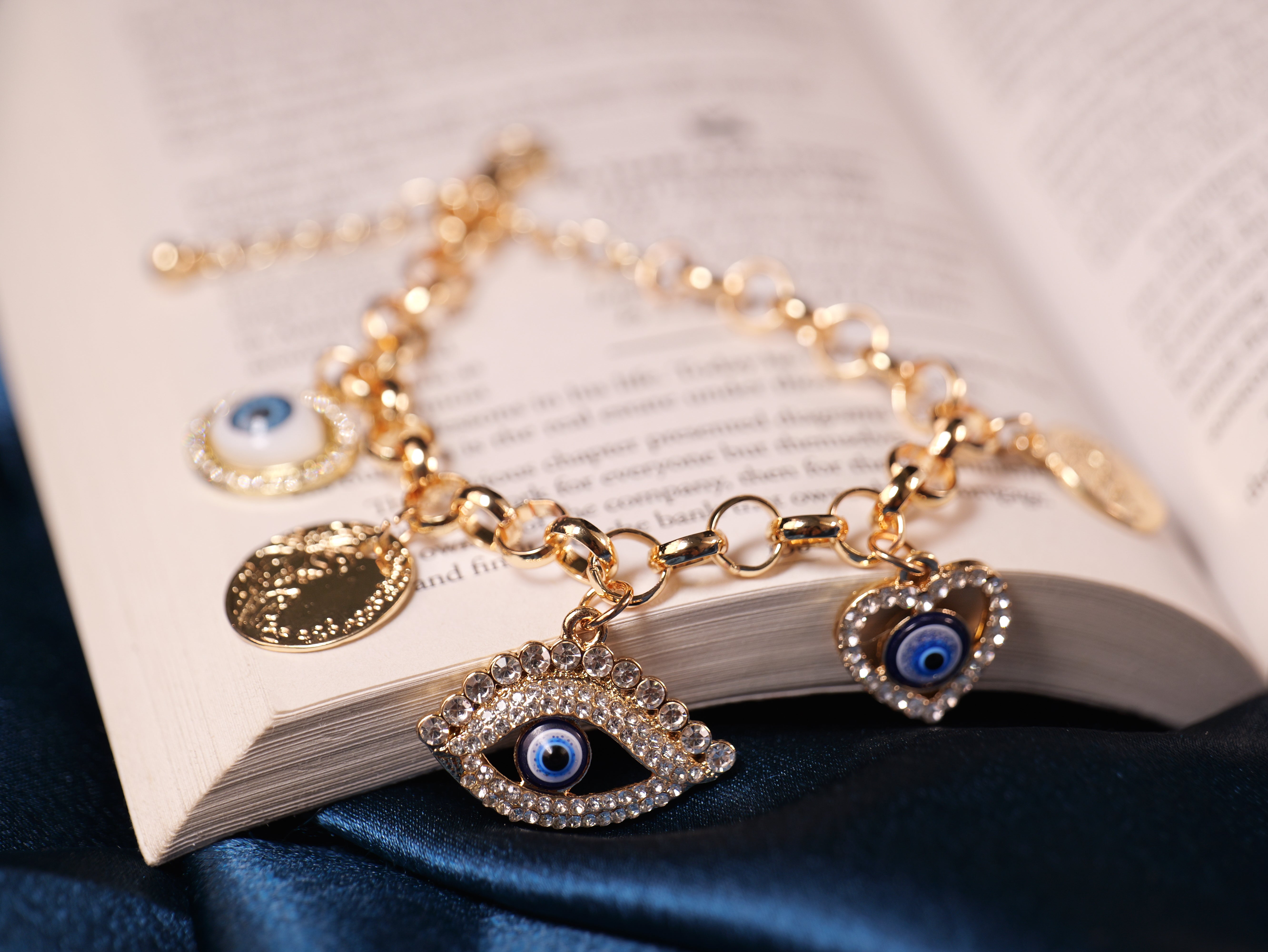 Elegant Gold-Tone Evil Eye Charm Bracelet with Crystals