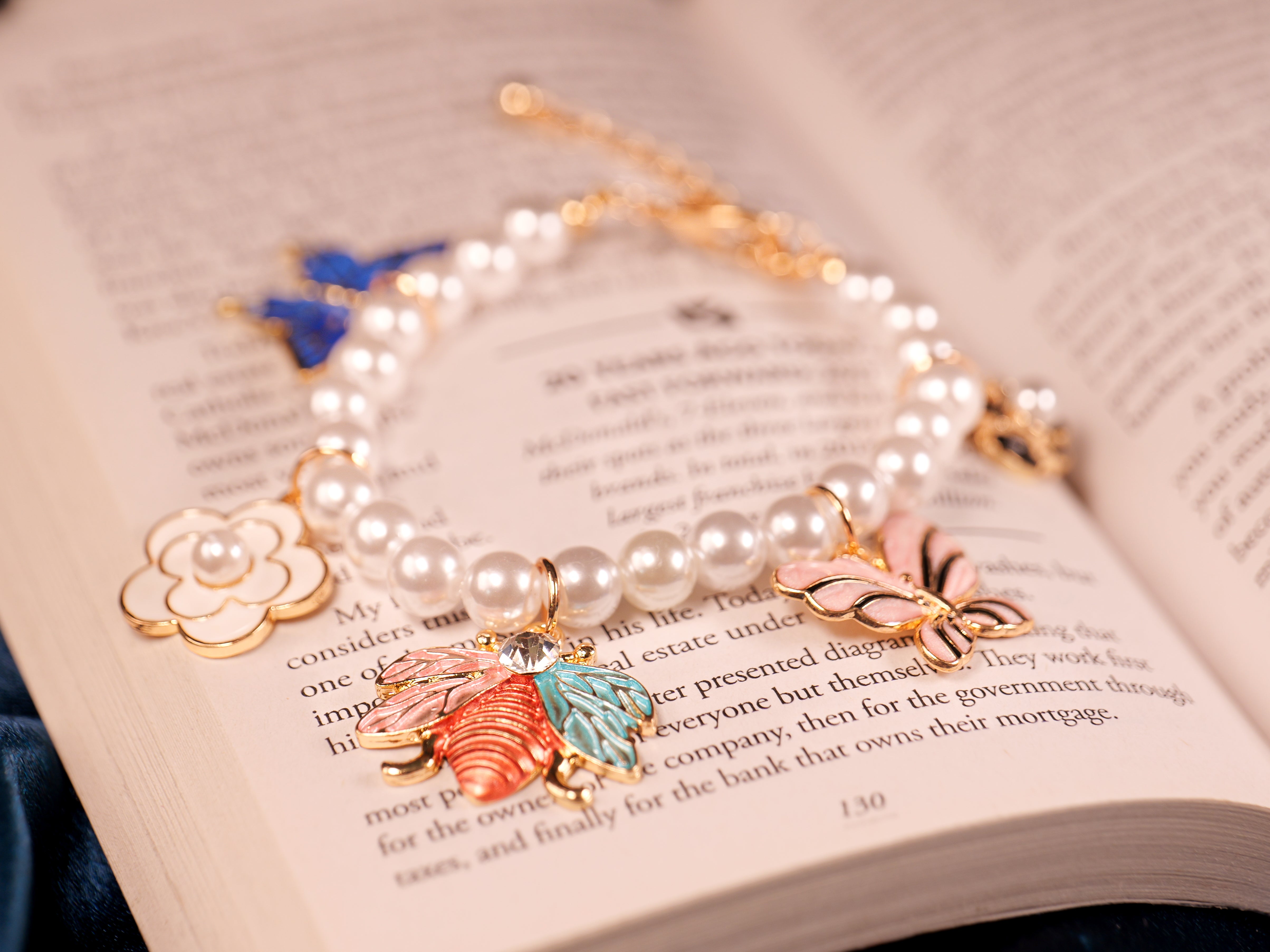 Elegant Pearl Beaded Charm Bracelet with Butterfly & Floral Accents